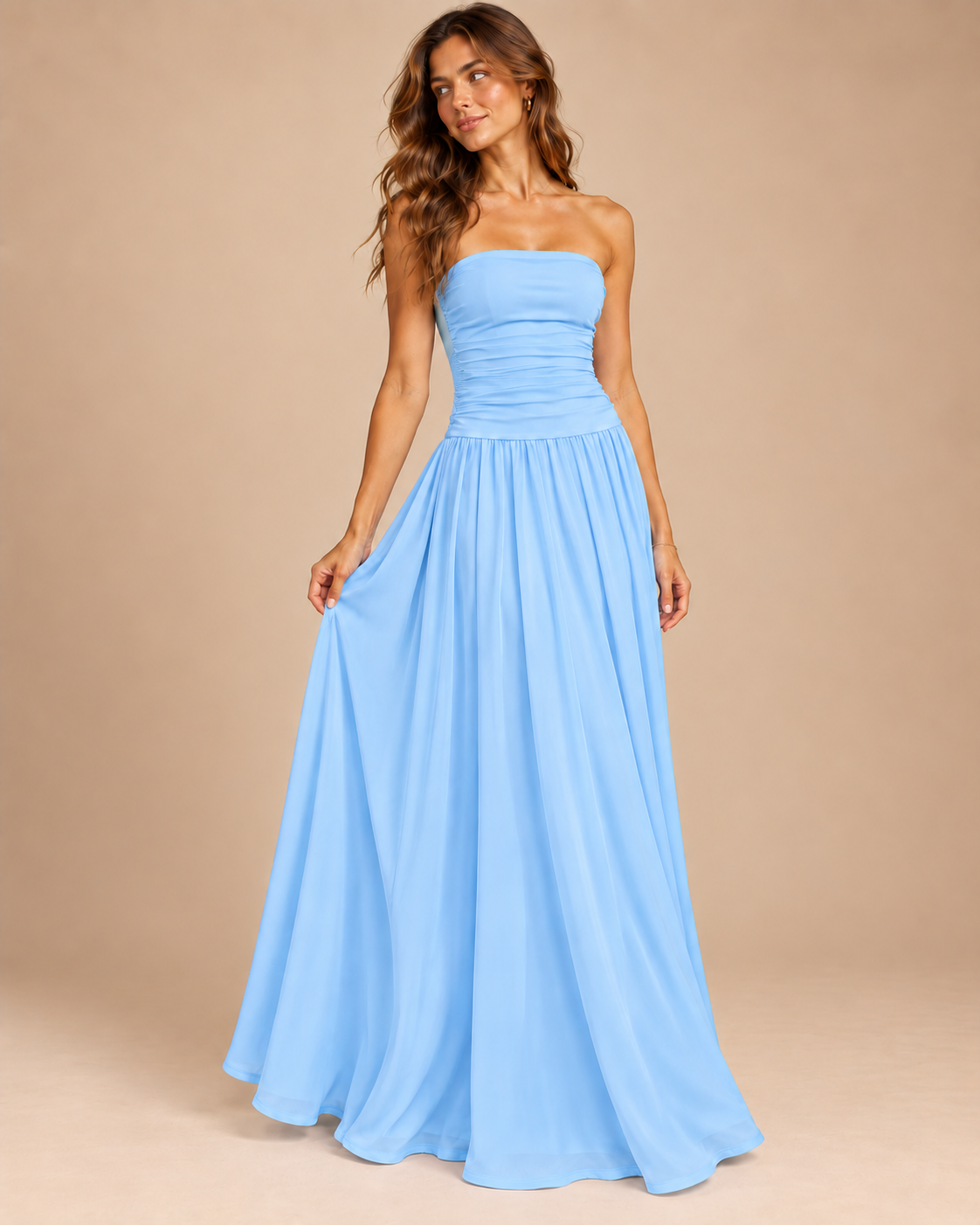 Strapless Ruched Drop Waist Maxi Dress in Baby Blue, on model, holding out the skirt