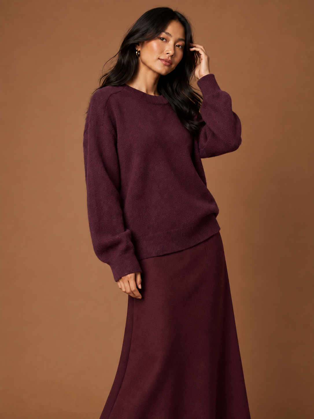 Close view of the soft knit jumper and burgundy maxi skirt