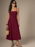 Model wearing the Tiered Cotton Midi Dress in Burgundy, front view