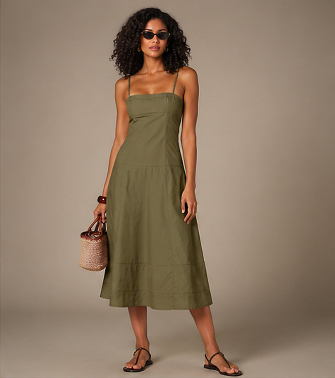 Model wearing the Tiered Cotton Midi Dress in Olive Green, front view