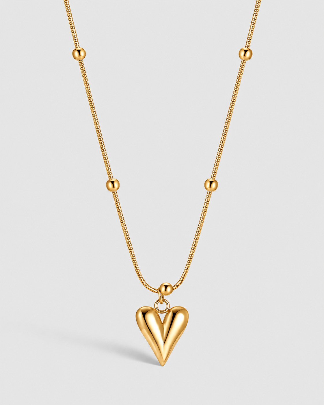 Gold Pendant Necklace with a heart pendant