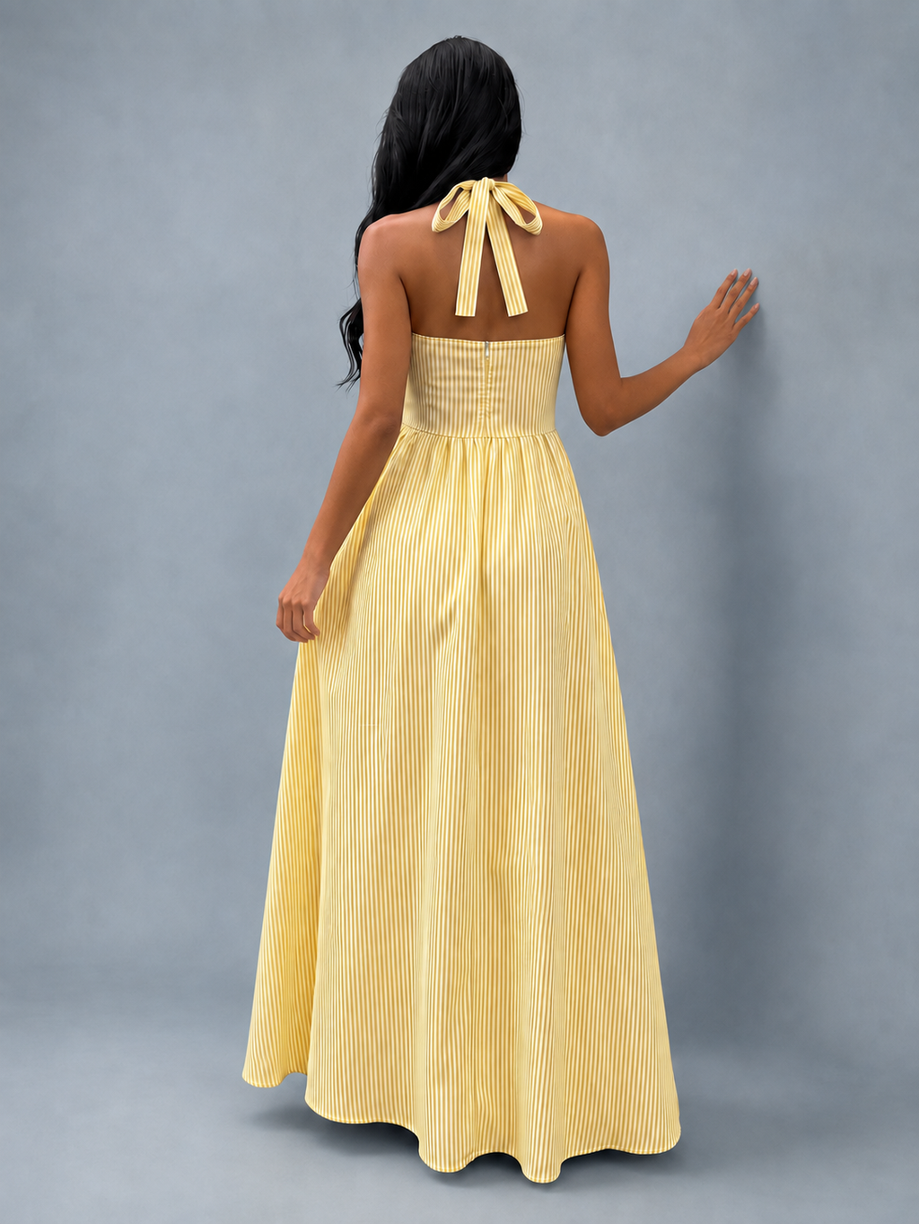 Back view of the yellow pinstripe halter maxi dress showing the tie-back neckline and zip
